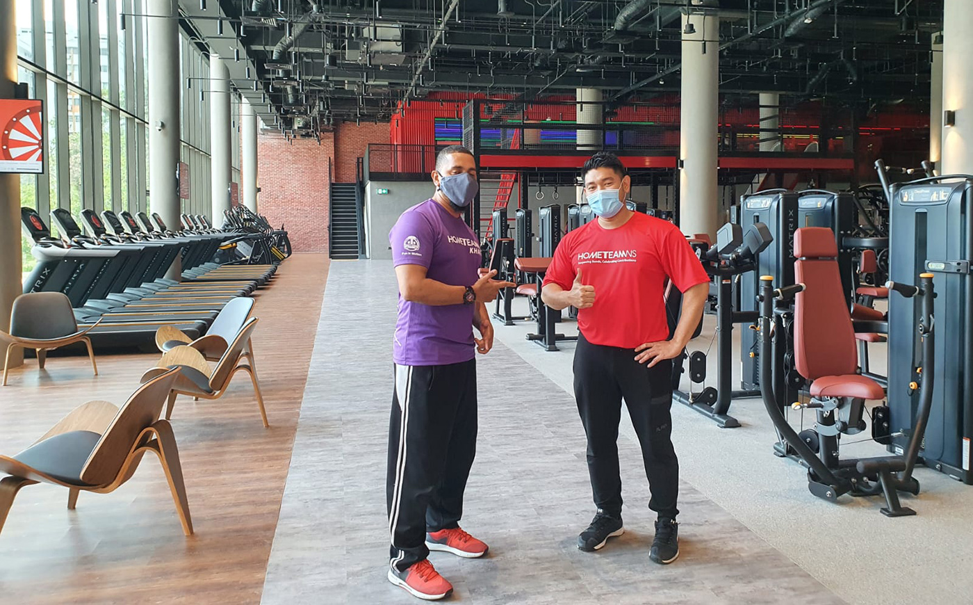 Fauzi (right) and Fitness Workz trainer Jamal strike a pose during the launch of Fitness Workz Premium at HomeTeamNS Khatib in 2020.