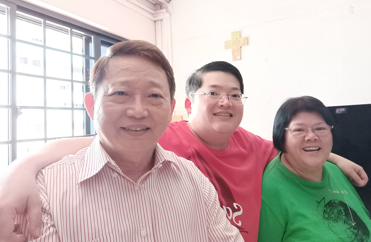 Mr Roger Tan with his son and Mdm Lim.
